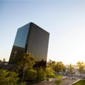 The building in the image appears to be the Park Tower located at 695 Town Center Drive in Costa Mesa, California.