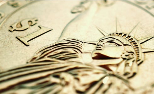The image appears to show the reverse side of a United States Presidential $1 coin featuring a rendering of the Statue of Liberty.